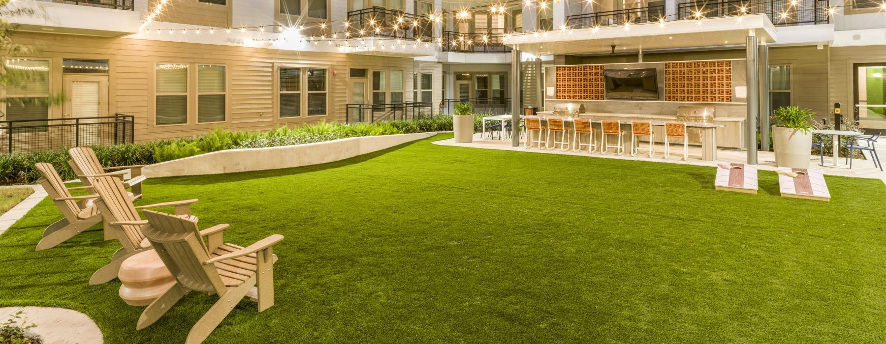 spacious lawn with string lighting overhead